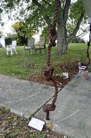 Forget Me KnotsKaren Duquette amist the Viva Sculpture