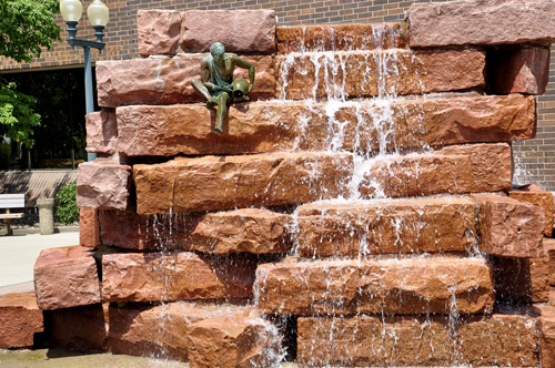 waterfall and a miniature man