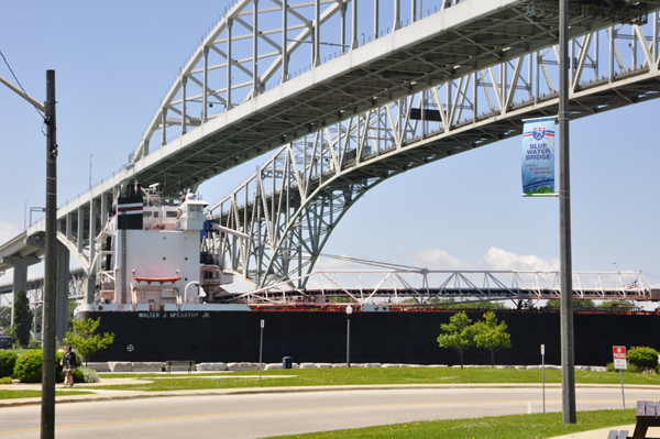 barge going under the Bluewater Bridge at Point Edward