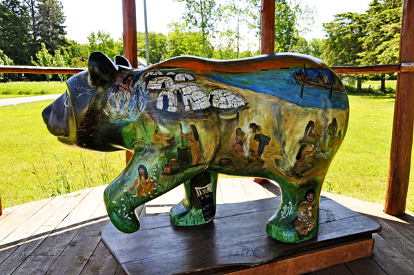 a painted Village Bear statue