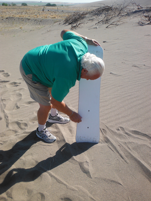 Lee Duquette waxing the sand board