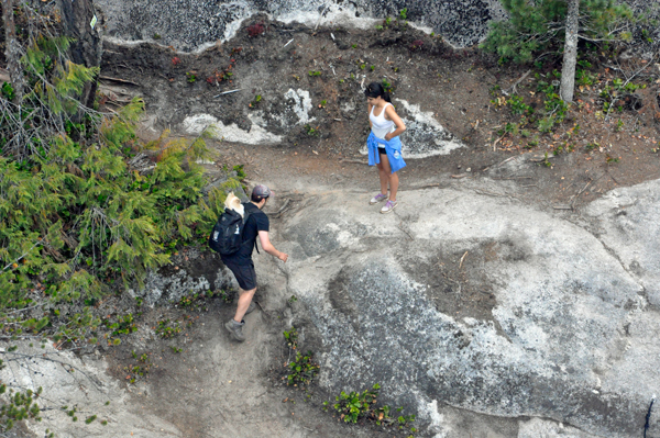 people hiking up the mountain