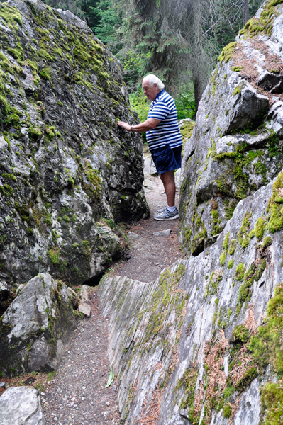 Lee Duquette examines the moss covered rocks