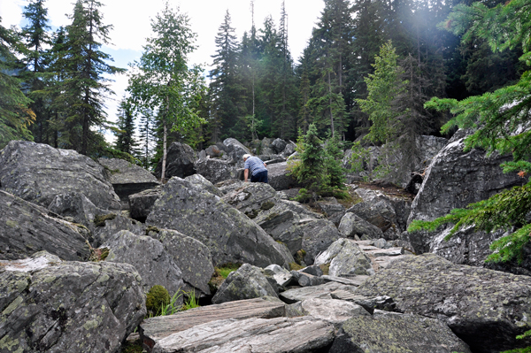 Lee Duquette climbing over the boulders