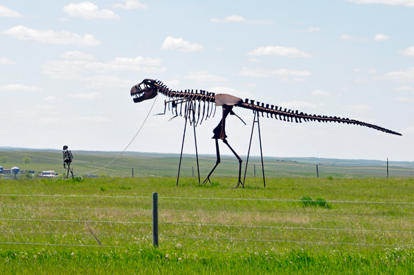 man walking a dinosaur