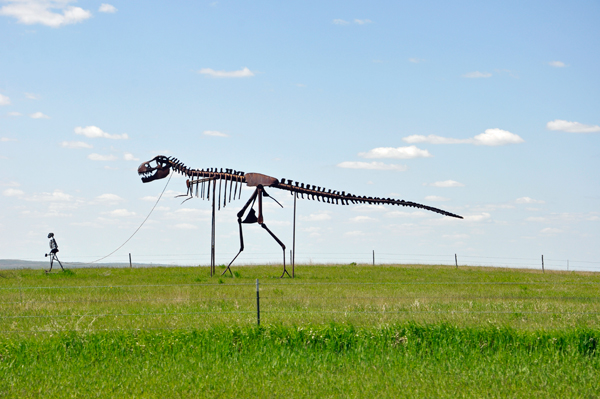 A man walking a dinosaur
