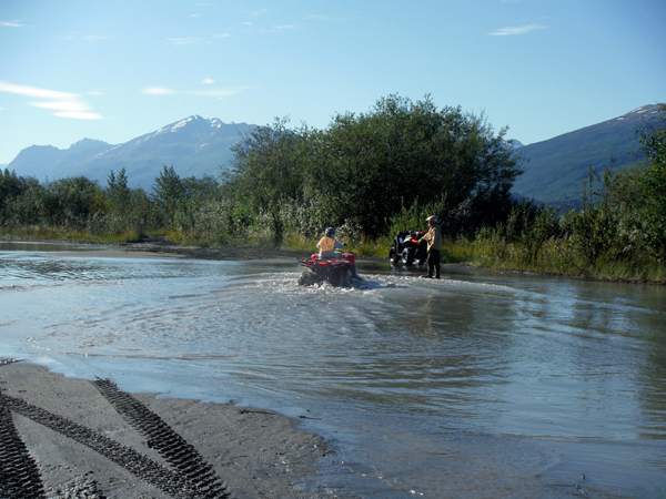 Karen Duquette crossing the river