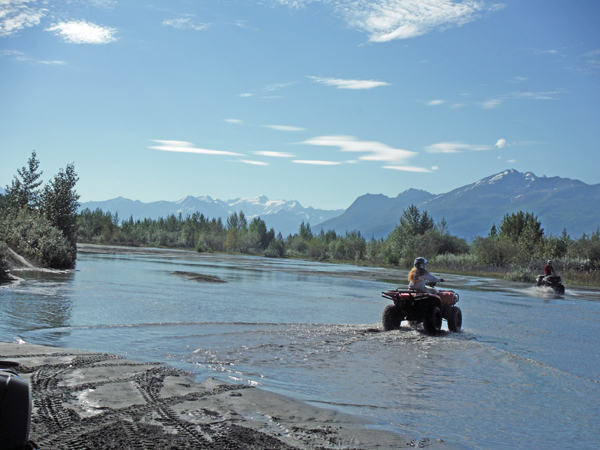 Karen Duquette crossing the river