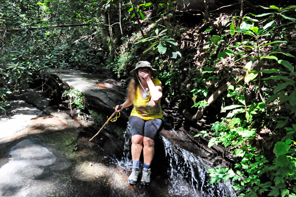 Karen Duquette splashing water on her face