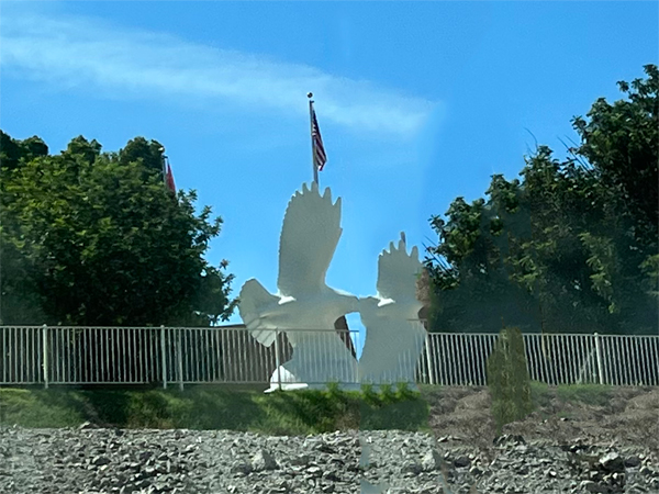 sculpture and a USA flag