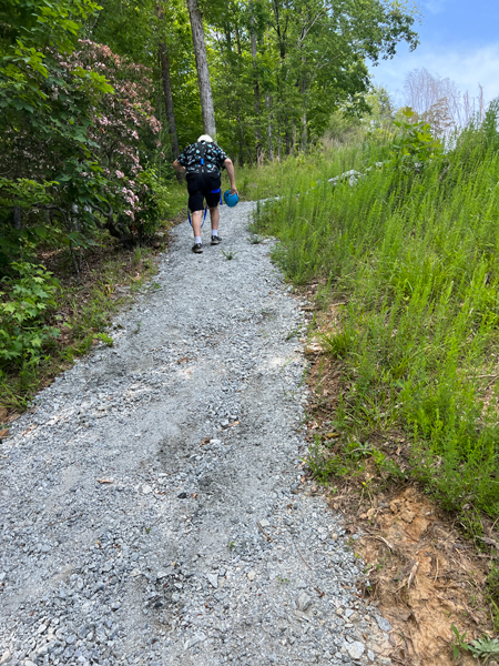 Lee Duquette walking up the hill
