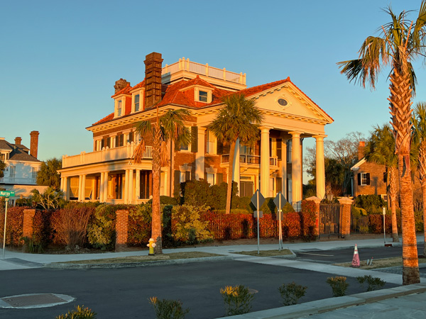 a big house lit by the sunset