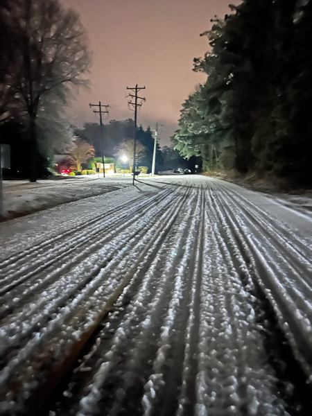 icy road after a few cars drove on it