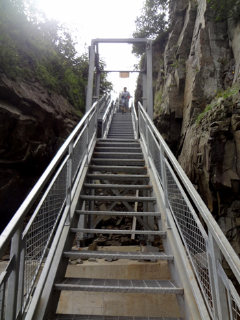 Karen Duquette on the stairs to the beach at Cape Enrage