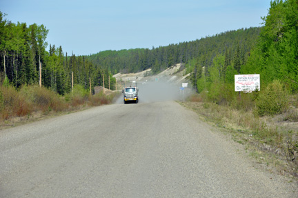 unpaved, gravel dirt road
