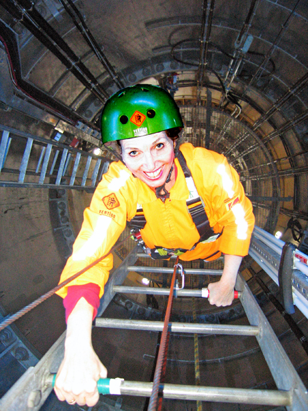 Karen Duquette climbing the ladder