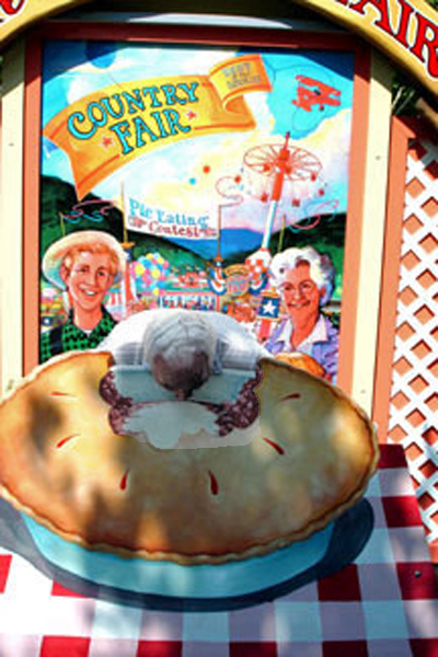 Below: Lee Duquette with his head in a pie